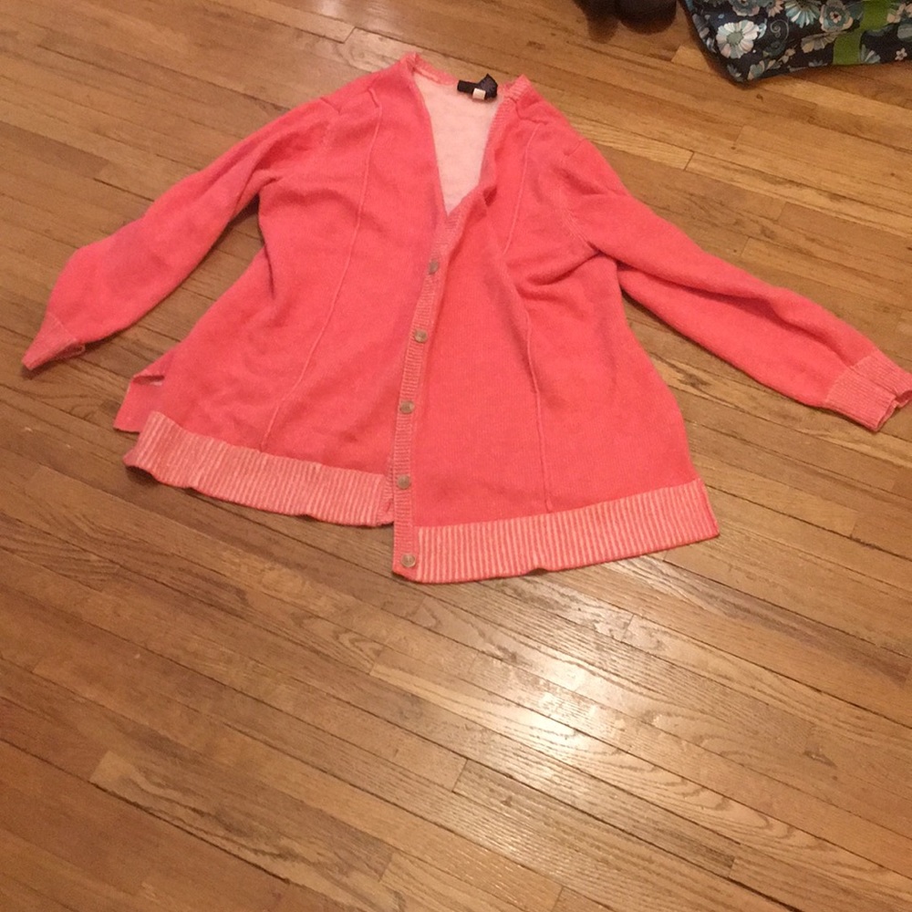 Pink button up sweater.